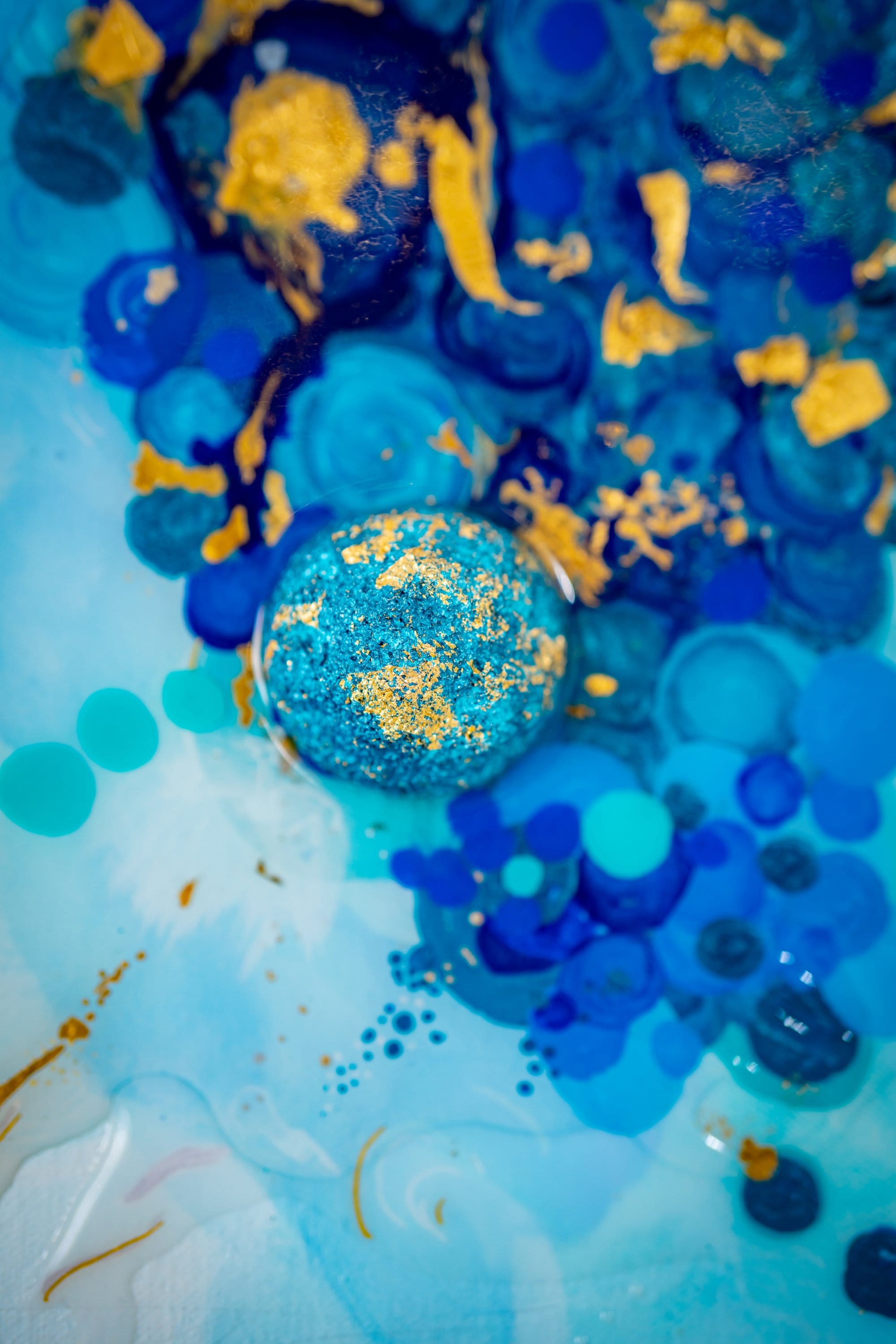 Macro gold leaf detail from Origin / Drift I, gold flakes on cerulean field