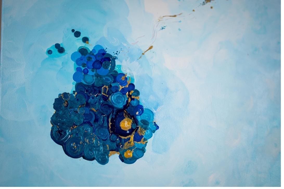 Detail of cluster blue circles painting showing layered translucent paint