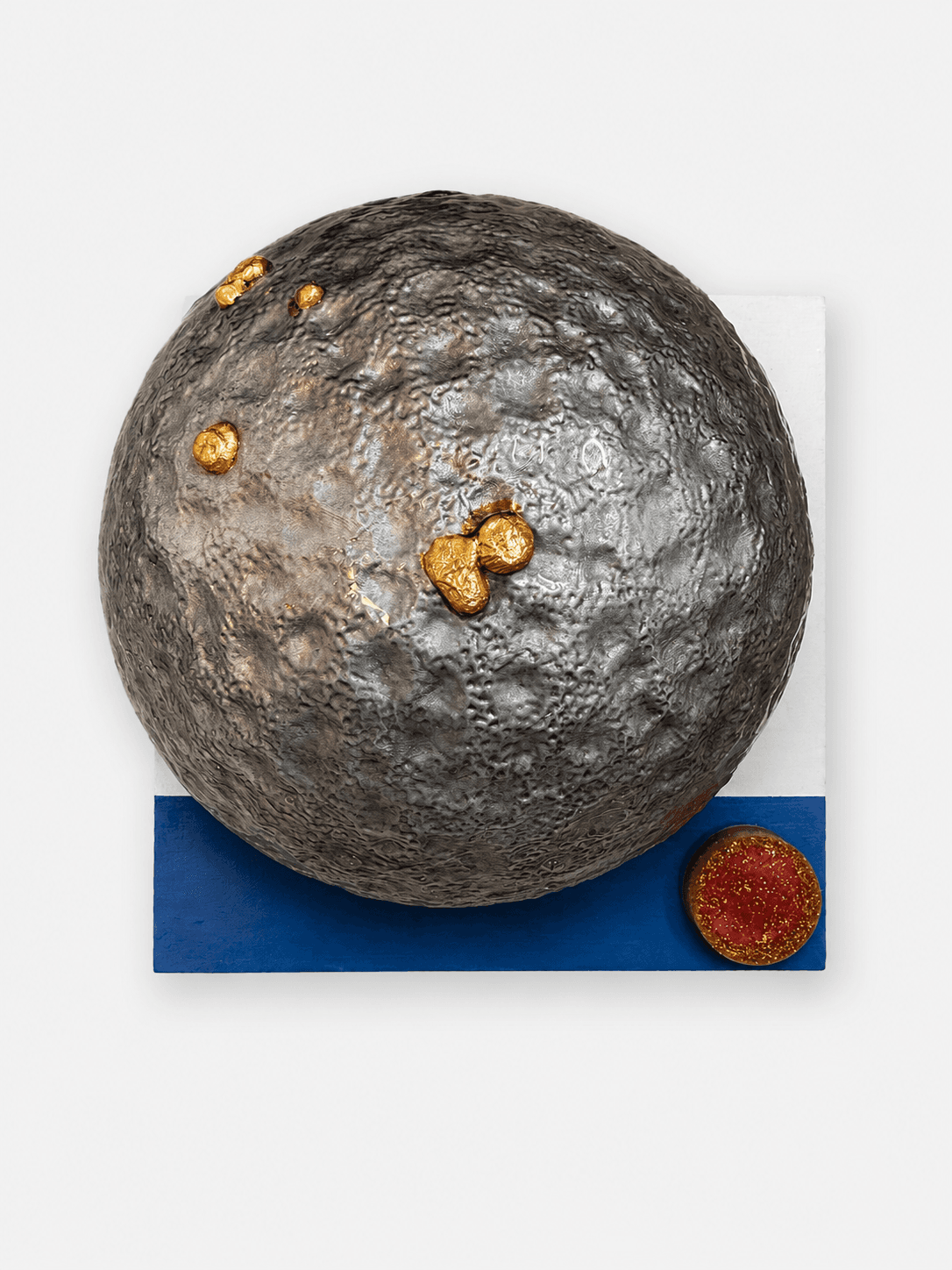 Origin / Mass I (sculptural) by Victoria Zeder — large textured silver-grey sphere with gold-leaf splashes on cream and cobalt panels