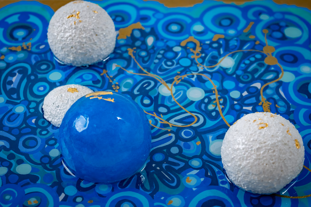 Genesis: macro detail of spheres and gold leaf border