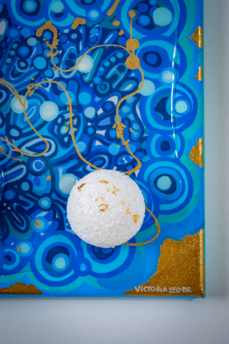 Genesis: angled detail showing resin seal and dimensional spheres