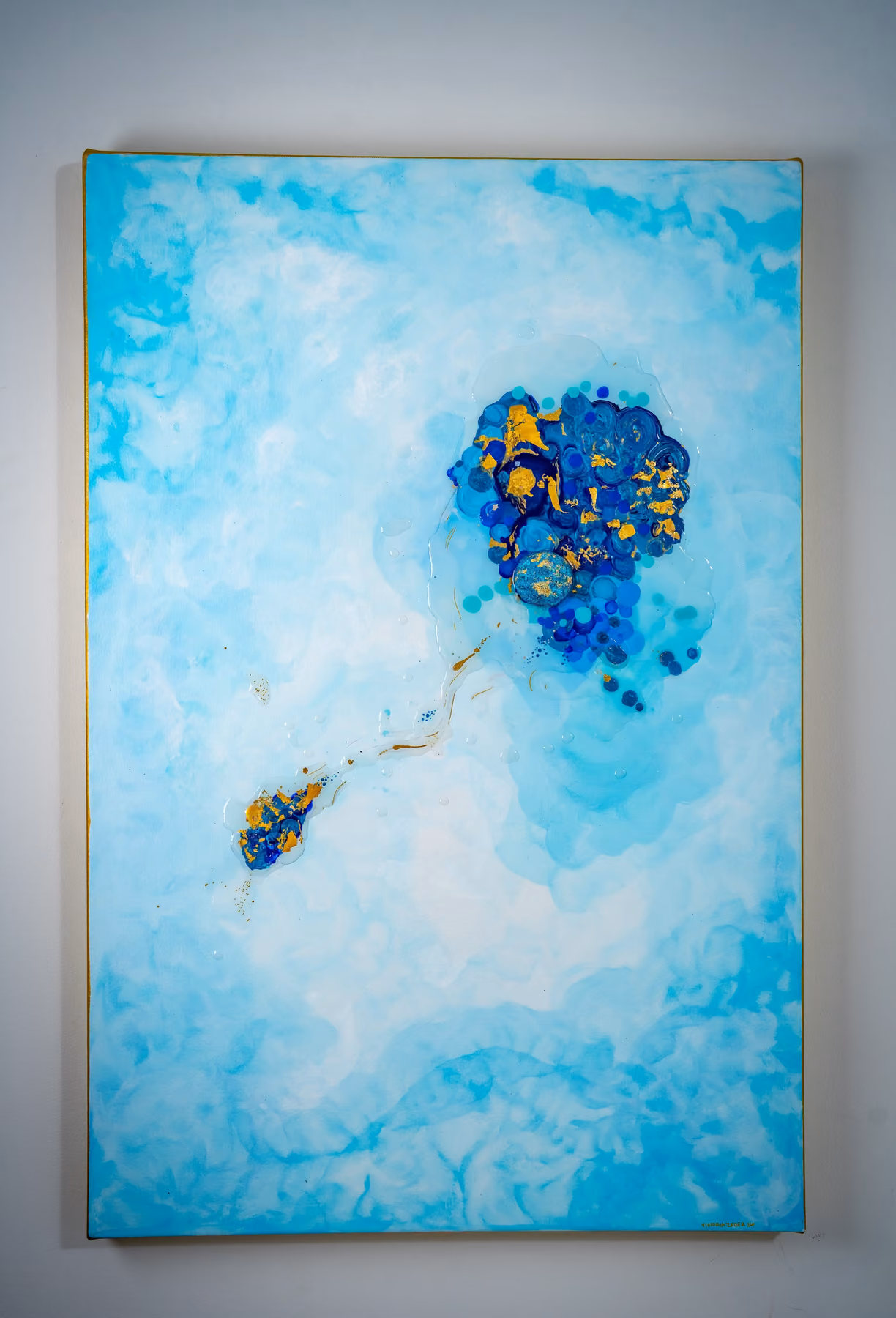 Origin / Drift I: the full framed canvas on the wall — the gold-leaf cluster trailing a thread to its satellite drift mass